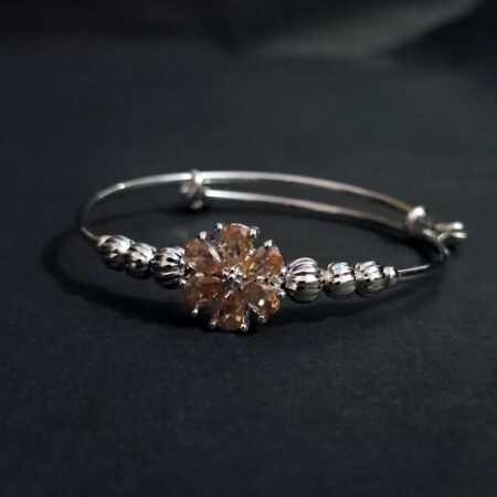 Silver-Toned Adjustable Bangle with Gemstone Flower