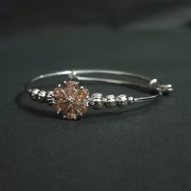 Silver-Toned Adjustable Bangle with Gemstone Flower