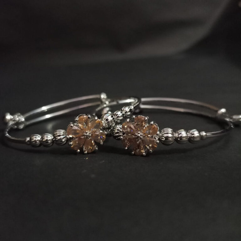 Silver-Toned Adjustable Bangle with Gemstone Flower
